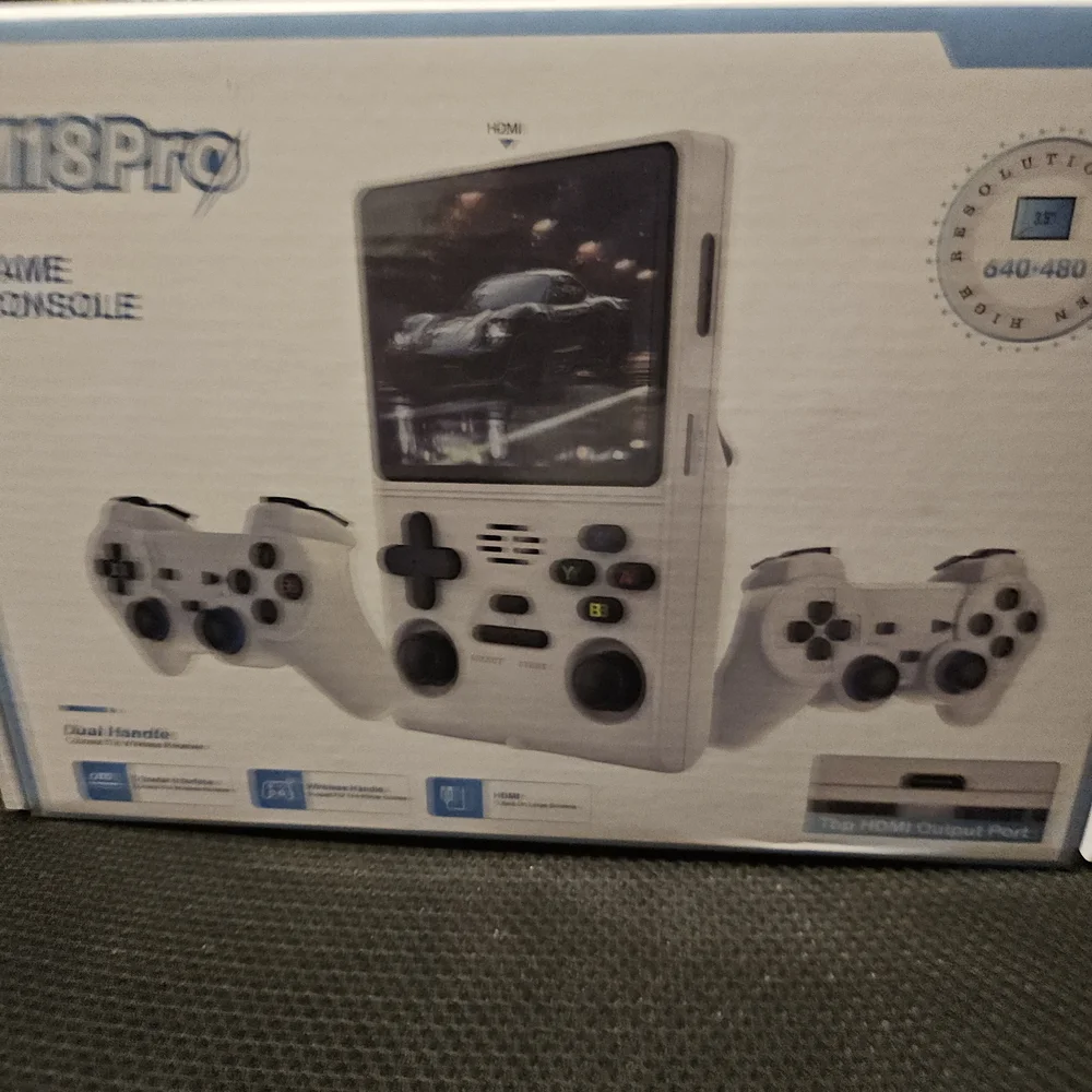White Handheld Gaming Console with Dual Controllers